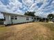 Well-maintained single-story home featuring a covered carport and mature landscaping at 2055 S Floral Ave # 262, Bartow, FL 33830