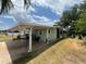 Exterior view showcasing the carport of a well-maintained single-story home near the water at 2055 S Floral Ave # 262, Bartow, FL 33830