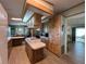 Bright kitchen featuring wood cabinets, an island cooktop, and ample counter space at 2055 S Floral Ave # 262, Bartow, FL 33830