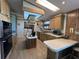 Spacious kitchen featuring a breakfast bar, lots of wood cabinets and modern appliances at 2055 S Floral Ave # 262, Bartow, FL 33830