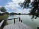 Picturesque lake view from dock featuring serene waters, lush shoreline, and clear blue sky creating a perfect spot to unwind at 2055 S Floral Ave # 262, Bartow, FL 33830