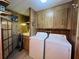 Laundry room with washer, dryer, cabinets and utility sink at 2055 S Floral Ave # 262, Bartow, FL 33830