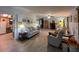 Open living space with sofa, lamps, and an open floorplan connecting to the kitchen and dining area at 2055 S Floral Ave # 262, Bartow, FL 33830