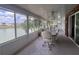 Bright sunroom with panoramic water views, comfortable seating, and plenty of natural light at 2055 S Floral Ave # 262, Bartow, FL 33830