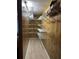 Walk-in closet with wood paneled walls and wire shelving at 2055 S Floral Ave # 262, Bartow, FL 33830