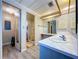 Bathroom showcases a sink, and a doorway leading to the shower area, with natural color scheme at 2055 S Floral Ave # 291, Bartow, FL 33830