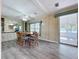 Cozy dining room includes built-in storage and seamless access to the sunroom, ideal for relaxation at 2055 S Floral Ave # 291, Bartow, FL 33830