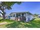 Inviting home with a covered patio, carport and well-manicured lawn, perfect for relaxed outdoor living at 2055 S Floral Ave # 291, Bartow, FL 33830