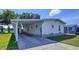 This charming home has a carport and manicured lawn with lovely curb appeal at 2055 S Floral Ave # 291, Bartow, FL 33830
