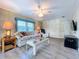 Cozy living room featuring comfortable seating, stylish decor, and ample natural light, creating an inviting space at 2055 S Floral Ave # 291, Bartow, FL 33830