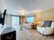 Inviting living area with comfortable seating, stylish lamps, and a ceiling fan for relaxation and comfort at 2055 S Floral Ave # 291, Bartow, FL 33830
