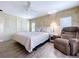 Main bedroom featuring a ceiling fan, two closets, and a recliner at 2055 S Floral Ave # 291, Bartow, FL 33830