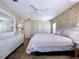 Main bedroom featuring a ceiling fan, a dresser, and closet doors at 2055 S Floral Ave # 291, Bartow, FL 33830