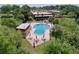 Community pool area with tables and chairs at 2055 S Floral Ave # 291, Bartow, FL 33830
