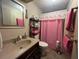 Bathroom featuring sink, toilet, linen closet and towel racks at 2055 S Floral Ave # 45, Bartow, FL 33830