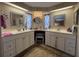 Ensuite bathroom featuring dual vanities, plenty of storage and makeup vanity at 2055 S Floral Ave # 45, Bartow, FL 33830