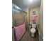 Bathroom with glass enclosed shower, toilet, towel bar and seashell decor at 2055 S Floral Ave # 45, Bartow, FL 33830