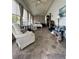 Sunroom-style bedroom with checkered tile and many windows at 2055 S Floral Ave # 45, Bartow, FL 33830