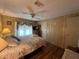 Bedroom features ceiling fan, side table, wood floors and large bed at 2055 S Floral Ave # 45, Bartow, FL 33830