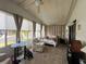 Sunroom-style bedroom with tile flooring and large windows at 2055 S Floral Ave # 45, Bartow, FL 33830