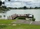Private wooden dock on the lake with boat access and peaceful surroundings at 2055 S Floral Ave # 45, Bartow, FL 33830