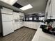 Functional kitchen area with white appliances, ample countertop space, and convenient layout at 2055 S Floral Ave # 45, Bartow, FL 33830