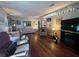 Inviting living room with hardwood floors, fireplace, and ample seating at 2055 S Floral Ave # 45, Bartow, FL 33830