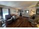 Open-concept living room with hardwood floors and natural light at 2055 S Floral Ave # 45, Bartow, FL 33830