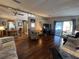 Bright living room with access to dining area and patio with a view to the bedroom at 2055 S Floral Ave # 45, Bartow, FL 33830