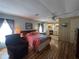 Bedroom featuring wood laminate flooring and an ensuite bathroom at 2055 S Floral Ave # 45, Bartow, FL 33830