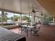 Relaxing screened patio with multiple seating areas and views of the pool and lush surroundings at 2055 S Floral Ave # 45, Bartow, FL 33830