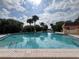 Large community pool with clear water, featuring a three-foot depth marker and relaxing atmosphere at 2055 S Floral Ave # 45, Bartow, FL 33830