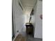 Exterior storage area with trash cans and a ladder, providing functional space at 2055 S Floral Ave # 45, Bartow, FL 33830