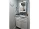 Charming bathroom features marble counters, white cabinets, and coastal decor at 2055 S Floral Ave # 69, Bartow, FL 33830