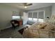 Cozy bedroom featuring a comfortable daybed, a chair by the window, and soft natural light at 2055 S Floral Ave # 69, Bartow, FL 33830