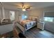 Bright bedroom featuring a comfortable bed, ample natural light, and convenient access to the bathroom at 2055 S Floral Ave # 69, Bartow, FL 33830