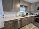 Modern kitchen with stainless steel appliances, ample counter space, and stylish cabinets at 2055 S Floral Ave # 69, Bartow, FL 33830