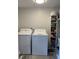 The laundry room includes a washer, dryer, shelving and storage at 2055 S Floral Ave # 69, Bartow, FL 33830