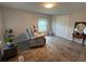 Comfortable living room with a plush recliner, classic rug, and a view of the outdoors at 2055 S Floral Ave # 69, Bartow, FL 33830