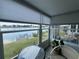 Bright sunroom with panoramic views of the serene lake, perfect for relaxing and enjoying nature at 2055 S Floral Ave # 69, Bartow, FL 33830