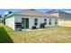 Backyard with a lawn and grill at 264 Fiddlewood Ct, Davenport, FL 33837