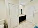 Bathroom featuring dark cabinets, granite vanity, and tile flooring at 264 Fiddlewood Ct, Davenport, FL 33837