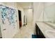 Bathroom featuring a shower with blue floral pattern and a large vanity at 264 Fiddlewood Ct, Davenport, FL 33837