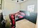 Bedroom featuring a bed with a colorful blanket, neutral carpet, and dark furniture at 264 Fiddlewood Ct, Davenport, FL 33837