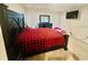 Main bedroom with wooden furniture and TV at 264 Fiddlewood Ct, Davenport, FL 33837