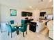 Bright dining area and modern kitchen with stainless steel appliances at 264 Fiddlewood Ct, Davenport, FL 33837