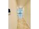 Hallway with tile flooring leading to an open floor plan and modern interior at 264 Fiddlewood Ct, Davenport, FL 33837