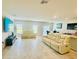 Living room showcases tile flooring, ample space, and stylish furniture arrangement at 264 Fiddlewood Ct, Davenport, FL 33837