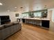 Modern kitchen with a large island, bar seating, and open layout, seamlessly connecting the kitchen to the living area at 2742 Pine Acres Dr, Lake Wales, FL 33898