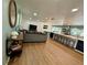 Open-concept living space with modern kitchen, comfortable seating, and ample natural light, perfect for entertaining and relaxing at 2742 Pine Acres Dr, Lake Wales, FL 33898